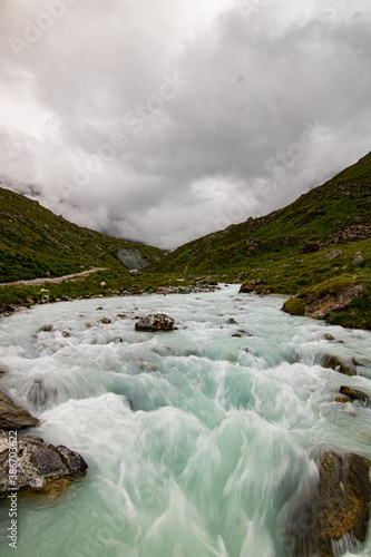 clear water of a wild mountain stream in Switzerland, Lac de Moiry photo