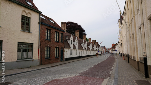 Bruges, Belgium - May 12, 2018:  Roofs And Windows Of Old Authentic Brick Houses On Street Vrijdagmarkt © CuteIdeas