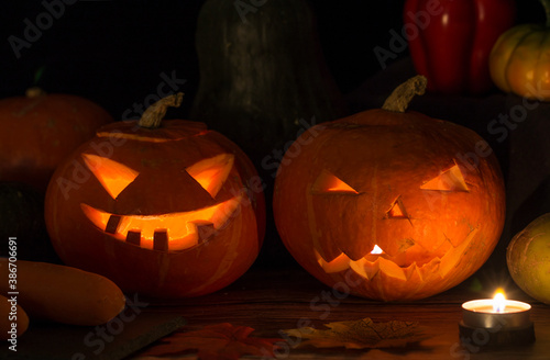 A jack-o '-lantern for Halloween is set against a black background