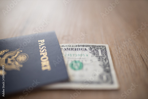 One-Dollar Bill Under a United States of America Passport