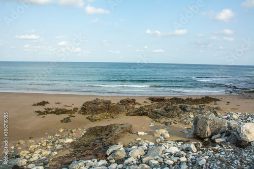 Rocky Al Aqah beach on the Gulf of Oman (part of the Indian Ocean) near the city of Fujairah, the capital of the emirate of Fujairah in the United Arab Emirates