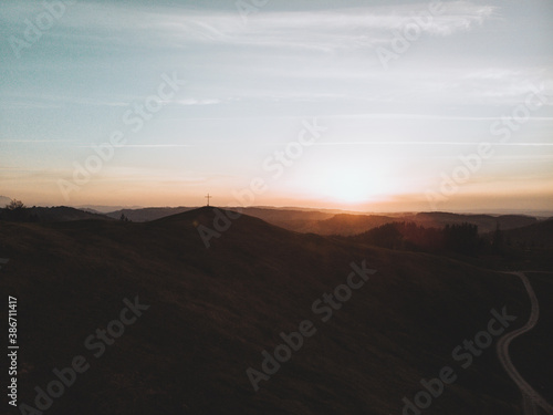 Allgäuer Gipfelkreuz während dem Sonnenuntergang photo