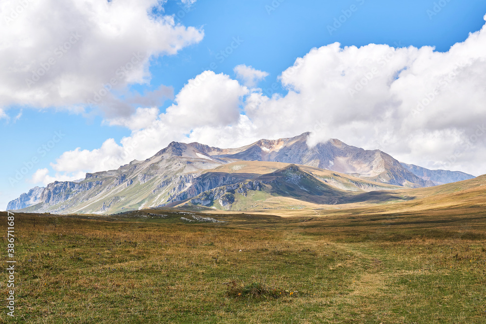 natural landscape with a beautiful mountain range on the horizon natural landscape with a beautiful mountain range on the horizon