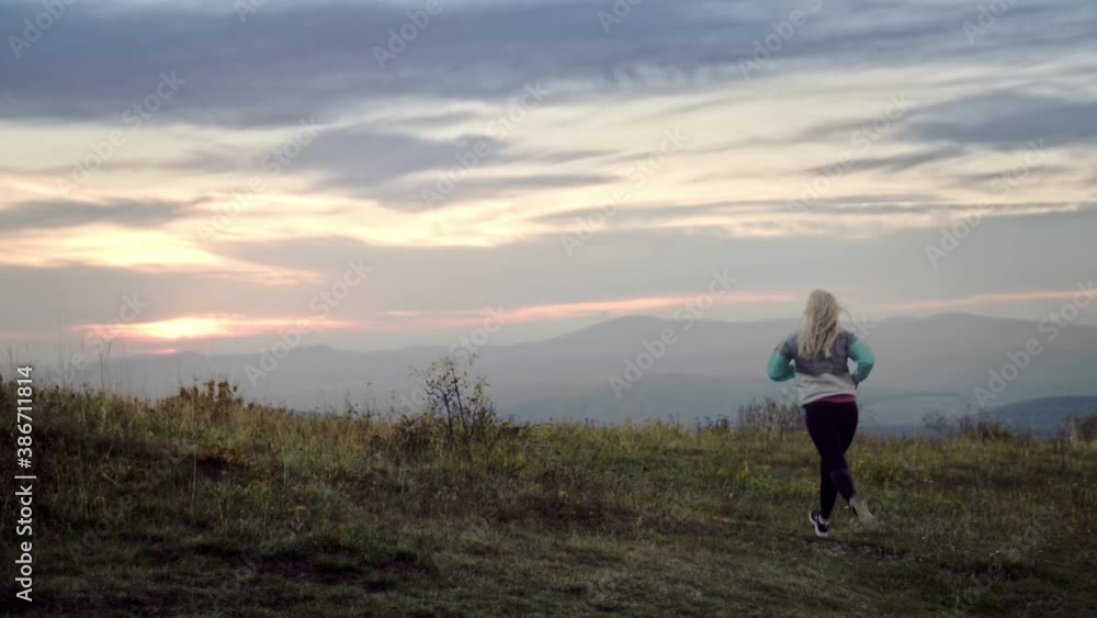 Evening run, Sport couple running in the nature at evening. 4K slow motion video Evening run, Sport couple running in the nature at evening. 4K slow motion video
