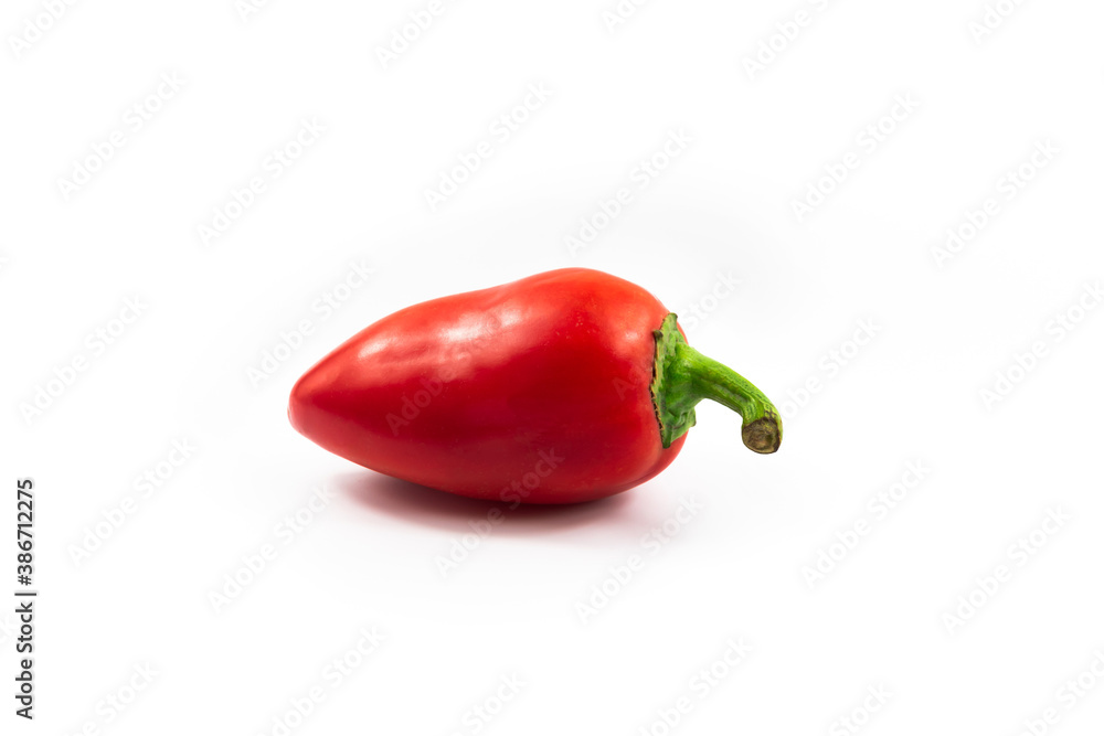 One red pepper on white isolated background, product for dishes One red pepper on white isolated background, product for dishes