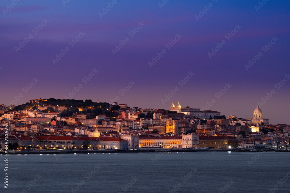 Panoramic view of the skyline of the downtown of the city of Lisbon at dusk, in Portugal