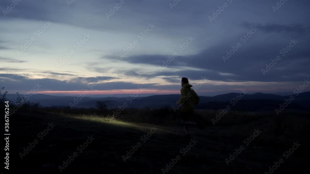 Night run with headlamp, Sport man running walking in the nature at night. 4K slow motion video Night run with headlamp, Sport man running walking in the nature at night. 4K slow motion video
