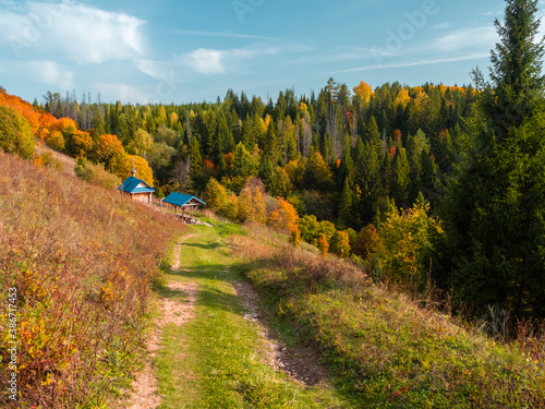 Dirt road to holy spring at the Stone Hill in the autumn, in a sunny day. photo