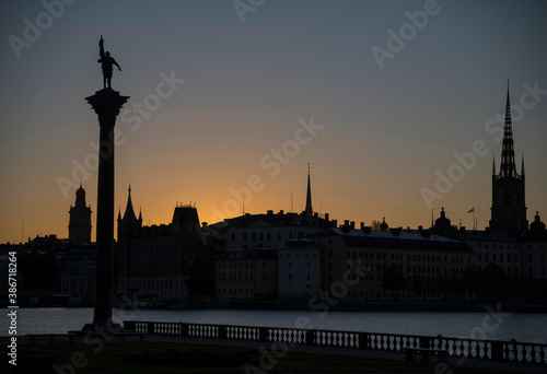 Orange silhouette skyline over the old town Gamla Stan in Stockholm at sunrise © Hans Baath