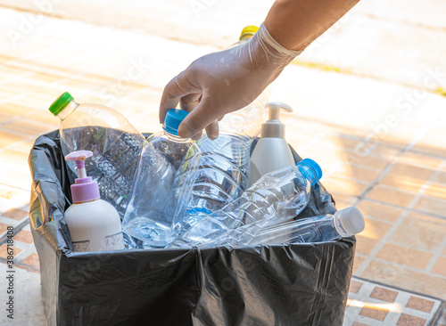 Wallpaper Mural Woman holding plastic bottles garbage in box to reuse recycle for good environment. Torontodigital.ca