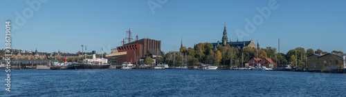 Panorama view over Stockholm inner harbor with boats, piers and islands an autumn day
