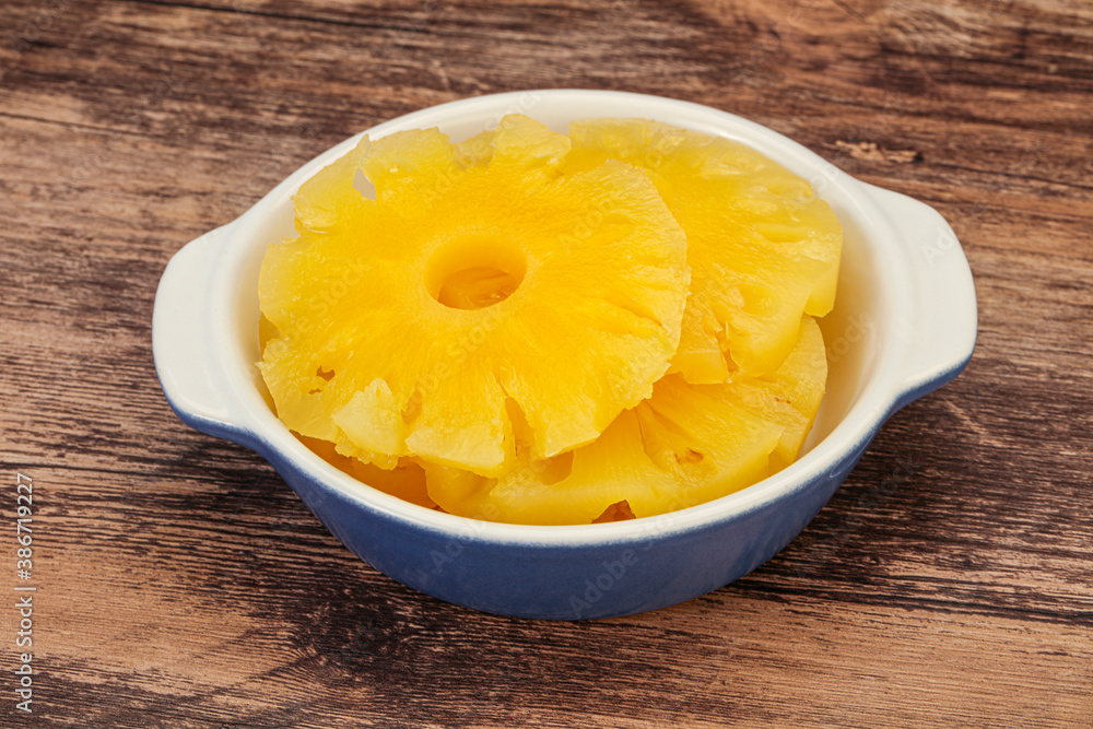 Marinated pineapple rings in the bowl Marinated pineapple rings in the bowl