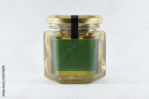 different glass jars filled on a white background