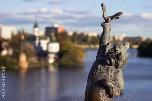 Vinnytsia, Ukraine -  14 October, 2020. Bronze sculpture of a cat with a butterfly on the Kiev bridge in Vinnitsa. Sculpture of an animal on the bridge over the Pivdennyi Buh River photo