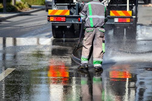 Cleaning and disinfects the streets with water truck