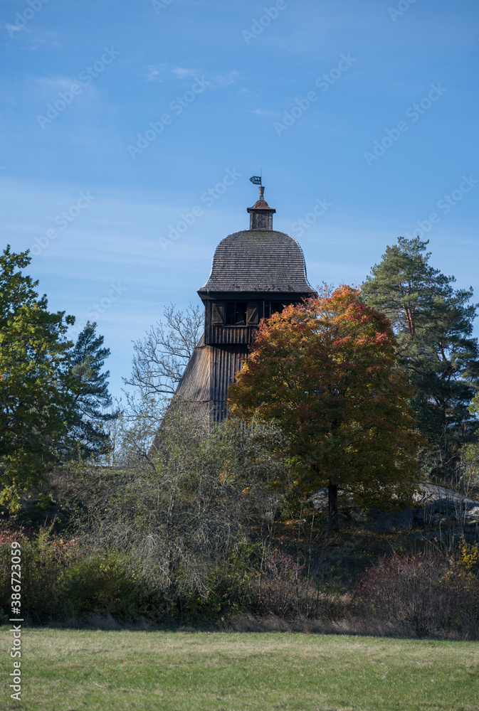 The clock steeple at Munsö church from 1100s in the district Ekerö, Stockholm