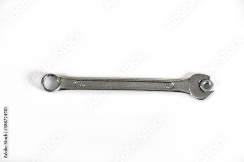 spanner No. 10 with nut isolated on white background