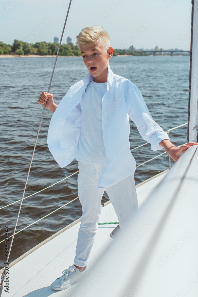 singing, blonde, blue, boat, boy, caucasian, crew, cruise, cute, education, fashion, fun, handsome, happy, leisure, lifestyle, male, marina, marine, nautical, navigator, outdoor, portrait, river, sail