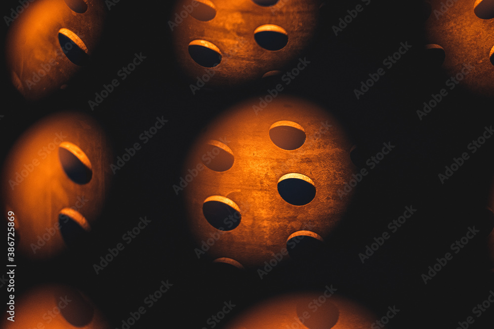 Fototapeta premium Inside of a metal cylinder with many holes around