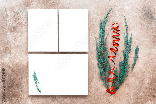 Blank business cards mockup and fir branches. Christmas stationery scene. Top view, flat lay. Template for your design.