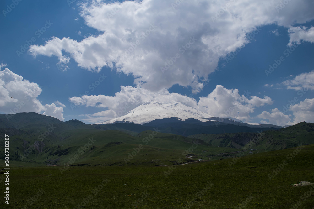 Mountain view. Mountains of the North Caucasus in summer. View of mount Elbrus. Eternal glacier.