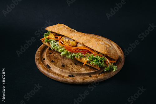 tasty chicken sandwich on wooden board. High quality photo