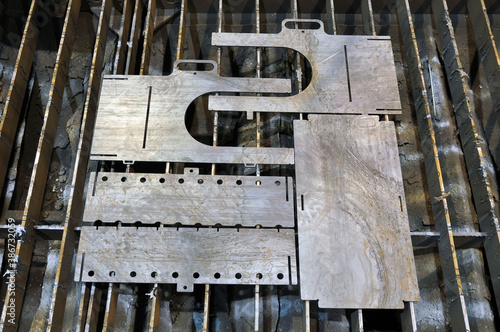 Details for a collapsible barbecue on the table for plasma cutting of metal.