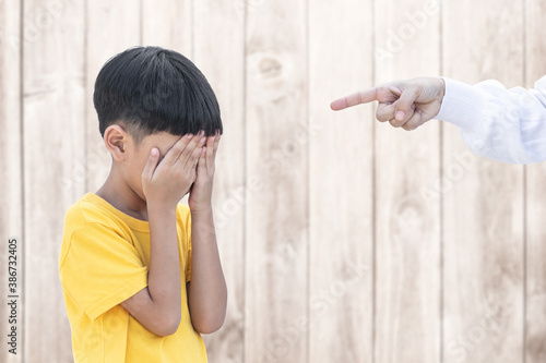 Photos Asian little child covered his eye