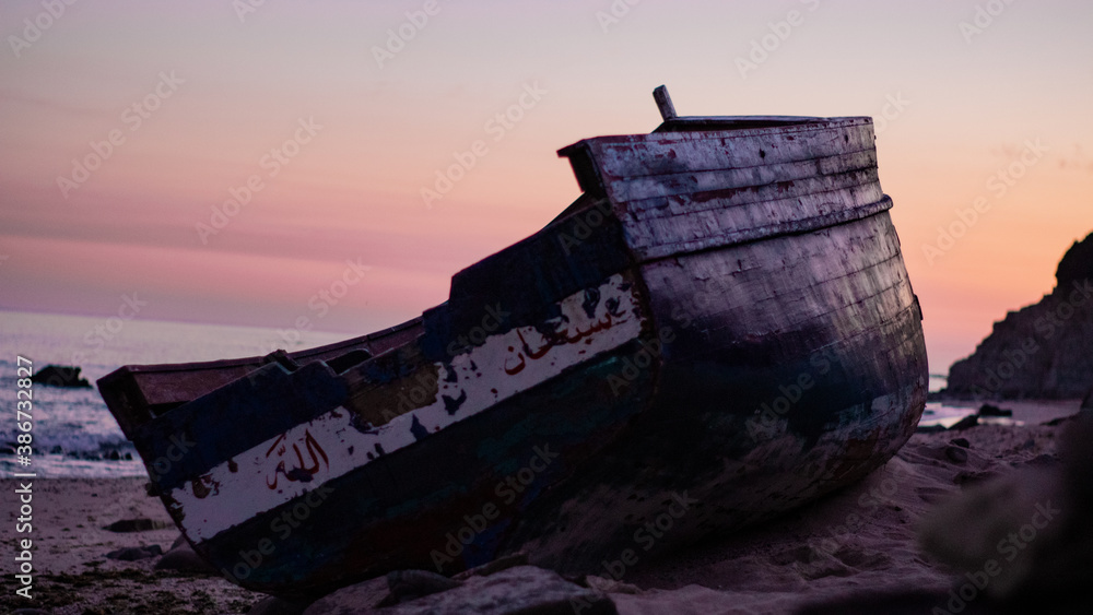 Fototapeta premium Abandoned Morocco boat in a beautiful beach