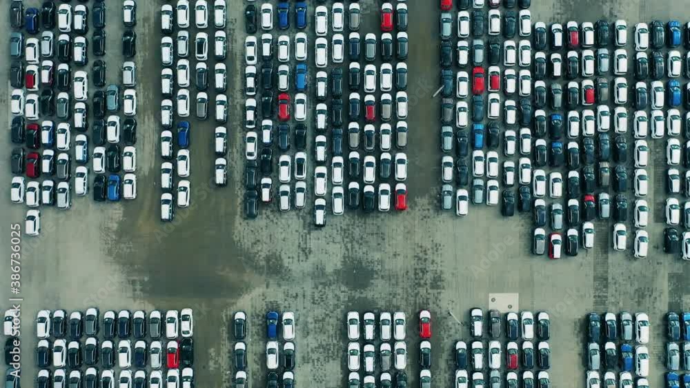 Rows of newly-manufactured cars filmed from above Rows of newly-manufactured cars filmed from above