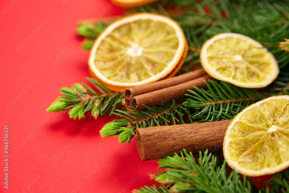 Dry orange slices with christmas tree branches and cinnamon sticks