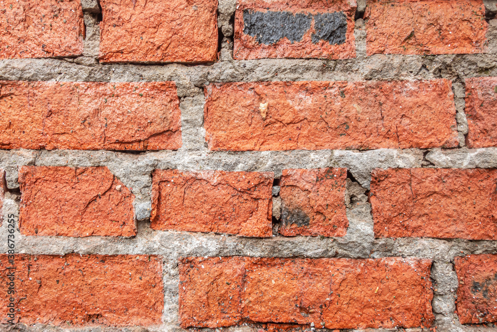 Obraz premium abstract background of an old red brick wall close up
