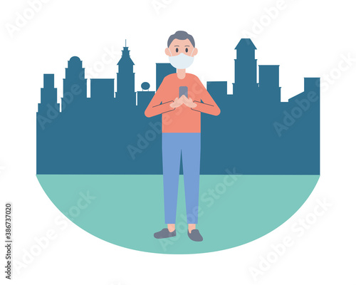 young man wearing face mask using smartphone