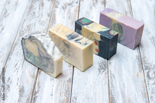 Hand made soap bars on wooden background. Zero waste concept