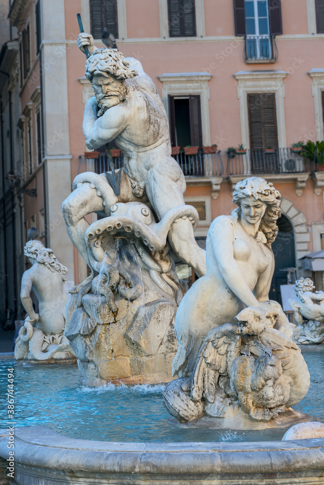 fragment of a fountain with antique sculptures in the historic center of Rome