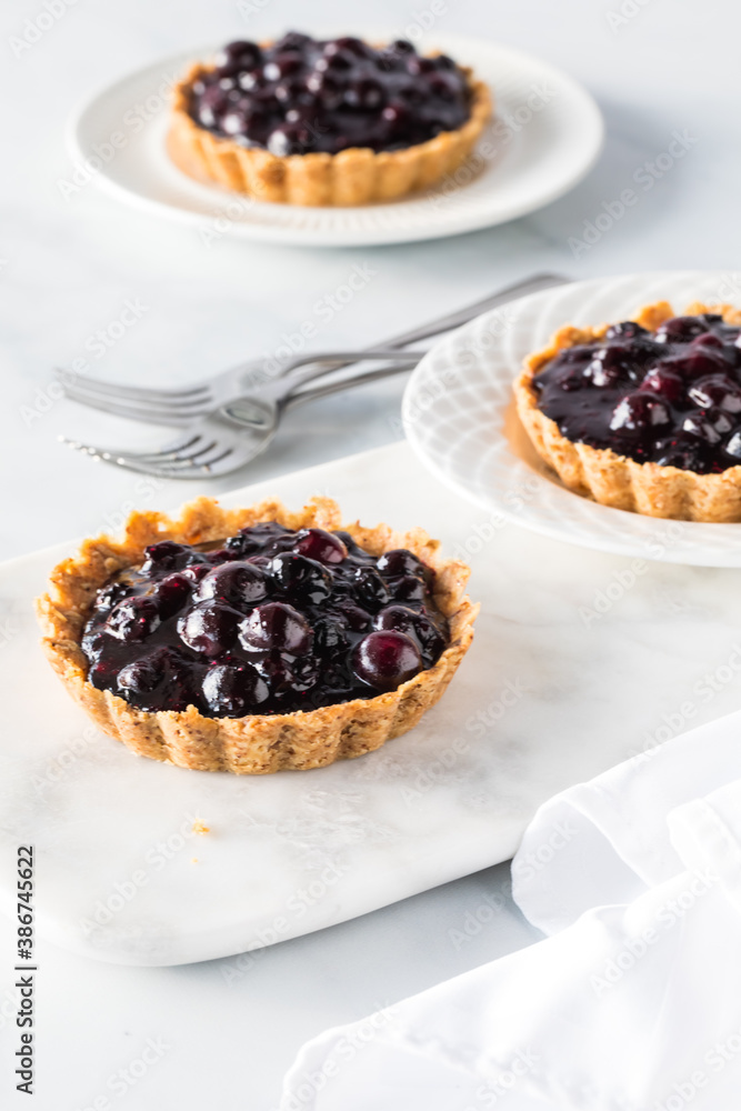Close up of fresh blueberry tarts ready for eating. Close up of fresh blueberry tarts ready for eating.