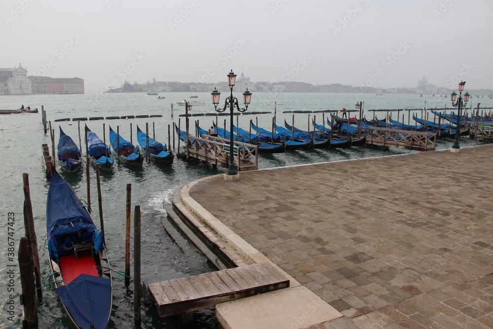 gondolas in Venice in winter on a rainy day