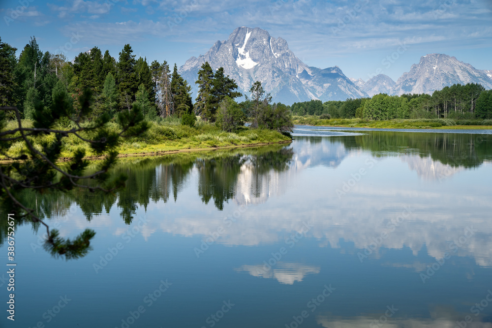 Daytime, sunshine view of the Grand Tetons from Oxbow Bend and the Snake River