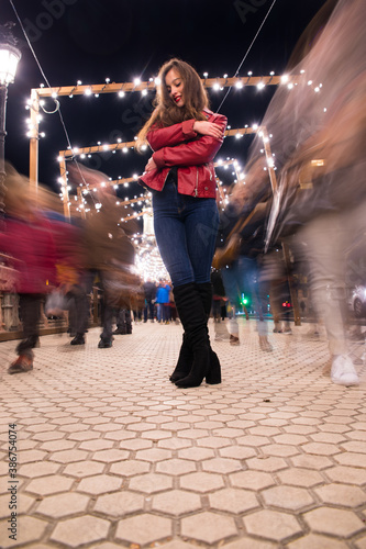 Girl going for a walk through Donostia-San Sebastian with the illuminations for Christmas.