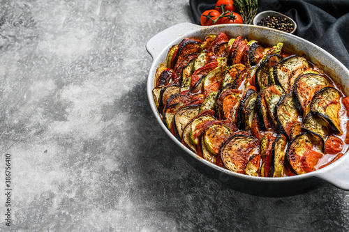 Ratatouille, homemade vegetable dish. Vegetarian food. Gray background. Top view. Copy space
