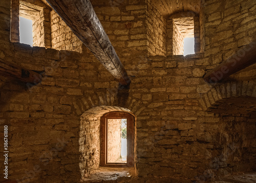 Interior of the old fortress tower. The window embrasures, thick walls.