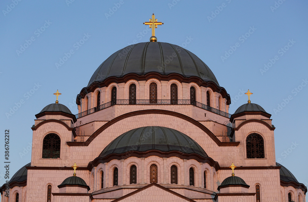 The Church of Saint Sava is seen backgrounded by a clear blue sky during a autumn evening in the city of Belgrade, Serbia.