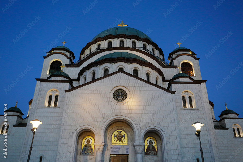 The Church of Saint Sava is seen backgrounded by a clear blue sky during a autumn evening in the city of Belgrade, Serbia.