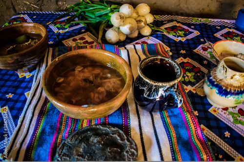 plato maya de cajola con cebolla y vaso a la par  photo