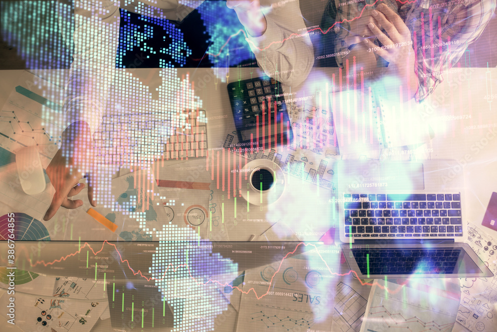 Double exposure of man and woman working together and financial chart hologram drawing. market analysis concept. Computer background. Top View.