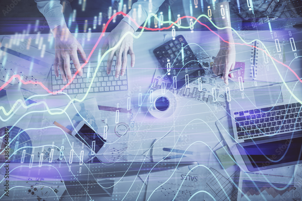 Double exposure of man and woman working together and financial chart hologram drawing. market analysis concept. Computer background. Top View. Double exposure of man and woman working together and financial chart hologram drawing. market analysis concept. Computer background. Top View.