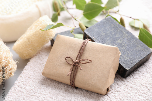 Natural tar soap on soft towel, closeup