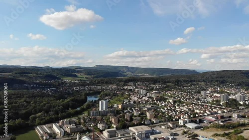 Aerial view of Brugg and Umiken, towns in canton Aargau, Switzerland. Industry, Railway, viaduct and residential area, seen from Habsburg forest. photo