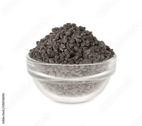 Black salt in glass bowl isolated on white