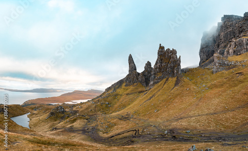 Beautiful travel landscape in the Isle of Skye at the Old Man of Storr, Scotland on a cloudy moody day - Autumn colours - Nature and travel concepts